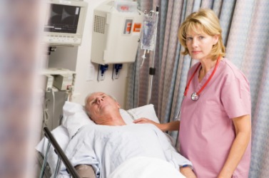 A nurse cares for a patient who has undergone surgery. A nurse cares for a patient who has undergone surgery.