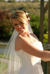 The brides faces reflects her happiness on her wedding day. The brides faces reflects her happiness on her wedding day.