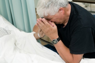 A man grieving for his friend in extremis. A man grieving for his friend in extremis.