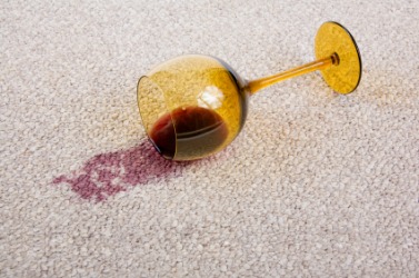 This spilled wine has marred the carpet. This spilled wine has marred the carpet.