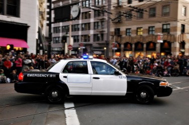 A police car obstructs the road. A police car obstructs the road.