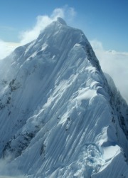 A snow covered mountain peak. A snow covered mountain peak.