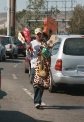 A street peddler selling guitars. A street peddler selling guitars.