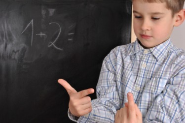 A child learning to add. A child learning to add.