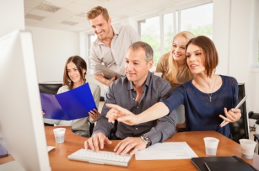 A group of colleagues working on a project. A group of colleagues working on a project.