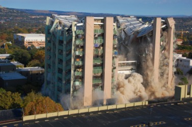 A building implodes. A building implodes.