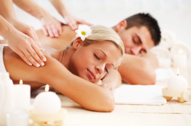 A couple enjoying a massage. A couple enjoying a massage.