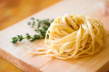 A pile of noodles with herbs. A pile of noodles with herbs.