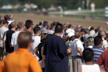 Numerous people at a race track. Numerous people at a race track.