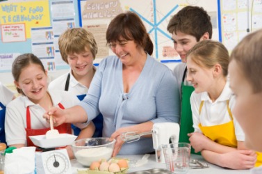 Students in a home economics class. Students in a home economics class.
