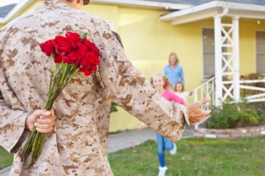 A soldiers reunion with his family. A soldiers reunion with his family.