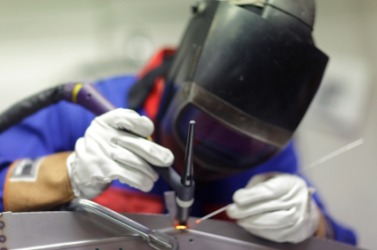 A man welding. A man welding.