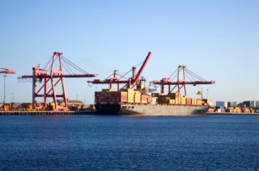 A ship unloading at a wharf. A ship unloading at a wharf.