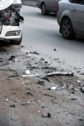 Debris in the road after a car crash. Debris in the road after a car crash.