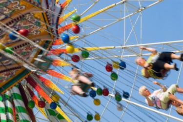 People on a ride at a kermis. People on a ride at a kermis.