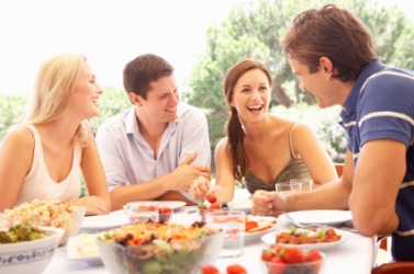 Friends enjoying a meal together. Friends enjoying a meal together.