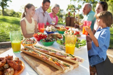 A group of people picnicking. A group of people picnicking.