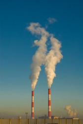 Smoke is billowing out of these factory chimneys. Smoke is billowing out of these factory chimneys.