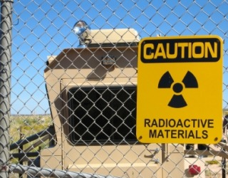 A sign warns of radiation. A sign warns of radiation.