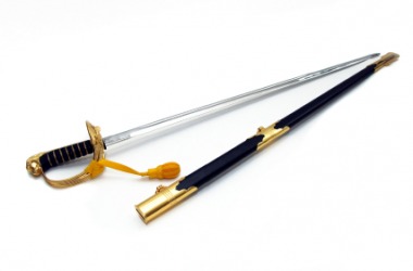 A sword lies next to it's sheath. A sword lies next to it's sheath.