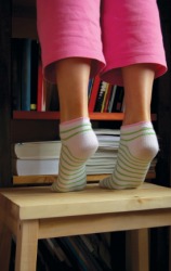 A child standing tippy-toe. A child standing tippy-toe.