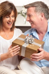 A woman accepts a gift. A woman accepts a gift.