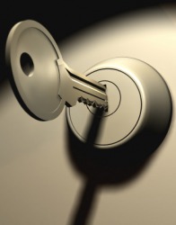 A key inserted in a lock. A key inserted in a lock.