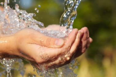 Water makes this woman's hands wet. Water makes this woman's hands wet.