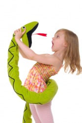 This girl exclaims over her toy. This girl exclaims over her toy.