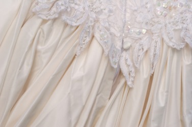 Gathered fabric on a wedding dress. Gathered fabric on a wedding dress.
