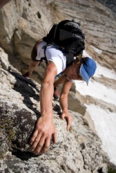 A woman endeavors to climb a mountain. A woman endeavors to climb a mountain.
