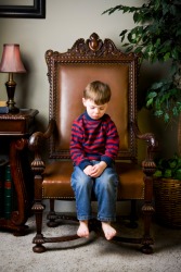 A child being punished as a consequence of his actions. A child being punished as a consequence of his actions.