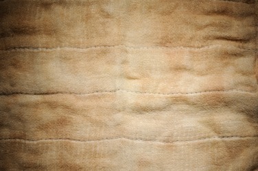 A piece of fabric showing discoloration. A piece of fabric showing discoloration.