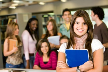 A girl standing with her peers. A girl standing with her peers.