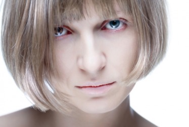 The woman's pallor indicates a health problem. The woman's pallor indicates a health problem.