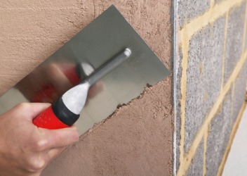 He will parge the wall with plaster in order to seal it from moisture. He will parge the wall with plaster in order to seal it from moisture.
