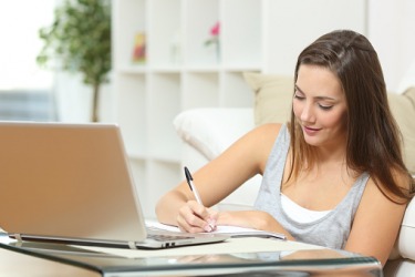 A woman working on her personal statement. A woman working on her personal statement.
