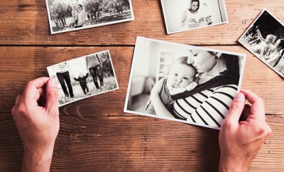Sorting through family photographs. Sorting through family photographs.