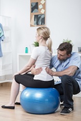 Treating a patient using physiotherapy. Treating a patient using physiotherapy.