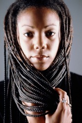 A woman with long plaits. A woman with long plaits.