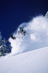 Skier in Deep Powder Skier in Deep Powder