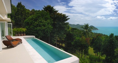 A secluded pool balcony overlooking the ocean offers gorgeous views and privacy. A secluded pool balcony overlooking the ocean offers gorgeous views and privacy.
