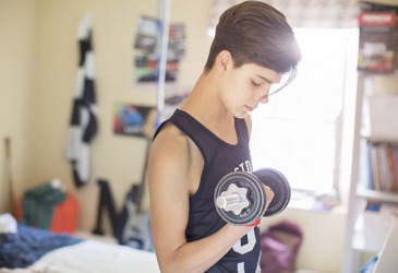 The teenage boy started to see the results of lifting weights after he went through puberty. The teenage boy started to see the results of lifting weights after he went through puberty.