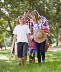 The Neilsen's decided to eat a picnic lunch in the park because it was relatively cool that day compared to the day before. The Neilsen's decided to eat a picnic lunch in the park because it was relatively cool that day compared to the day before.