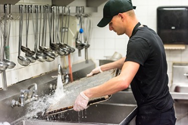 Mitch was relegated to washing dishes as a result of being late to work too many times. Mitch was relegated to washing dishes as a result of being late to work too many times.