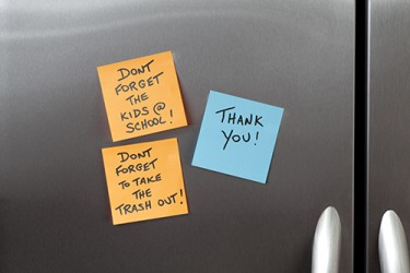 Robyn left a sticky note reminder on the refrigerator for her husband to pick up the kids and take out the trash. Robyn left a sticky note reminder on the refrigerator for her husband to pick up the kids and take out the trash.