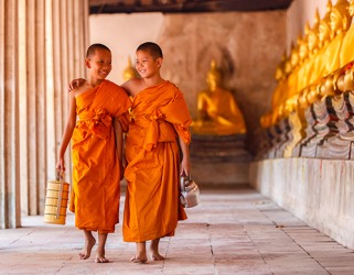 The young monk apprentices are at peace with their renunciation of material possessions in order to attain spiritual enlightenment. The young monk apprentices are at peace with their renunciation of material possessions in order to attain spiritual enlightenment.