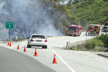 Travellers were rerouted when the exit had to be closed due to the brush fire. Travellers were rerouted when the exit had to be closed due to the brush fire.