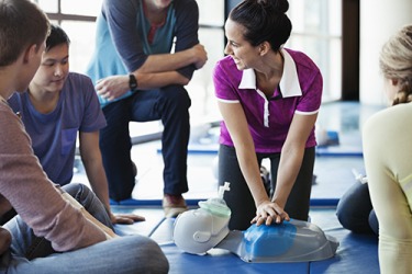The students are taking a CPR class to learn how to resuscitate someone who has stopped breathing. The students are taking a CPR class to learn how to resuscitate someone who has stopped breathing.