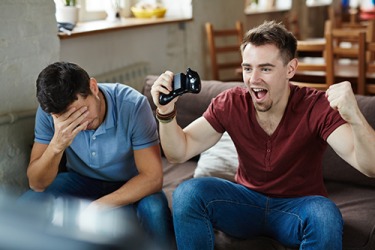 After winning the video game for the tenth time in a row, Neil's obnoxious revelling started to annoy his friend. After winning the video game for the tenth time in a row, Neil's obnoxious revelling started to annoy his friend.